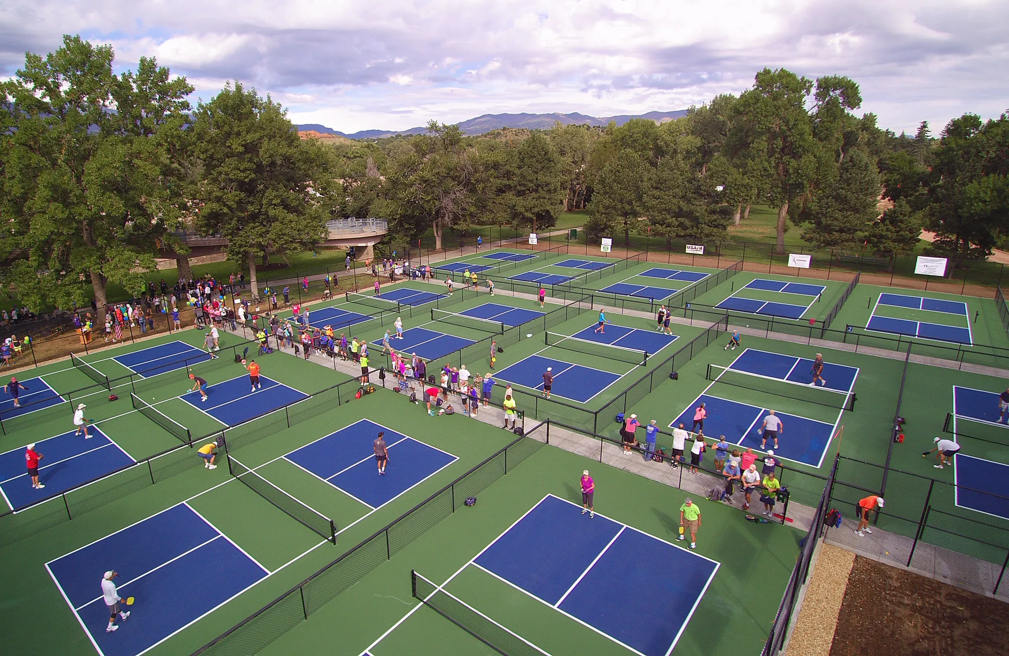 Pickleball court flooring system with Daktronics scoreboard for indoor and outdoor sports facilities